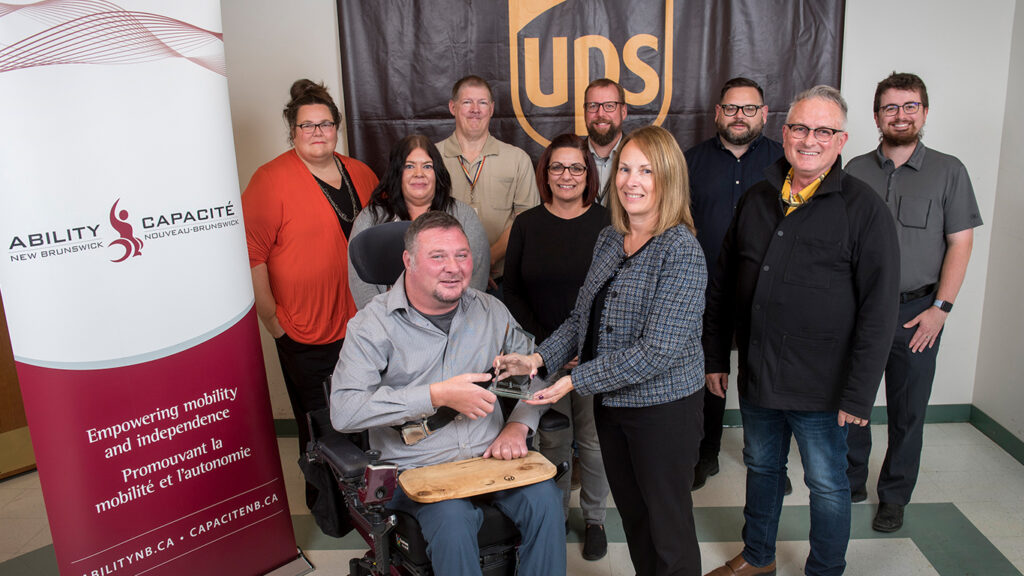 In photo, left to right, front row: George Woodworth, Ability NB Past-President & Tammy Bilodeau; second row: Joy Palmer, Josephine Nelson, Peter Shaw; third row: Amanda Norcott, Lee Caswell, Jonathan Davenport, Nick Brown & Dmitri Makrides.